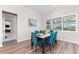 Bright dining area with seating for six and plenty of natural light through plantation shutters at 17916 Northwood Pl, Lakewood Ranch, FL 34202