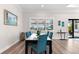 Elegant dining room featuring a window with view, seating for six, and modern decor at 17916 Northwood Pl, Lakewood Ranch, FL 34202