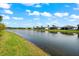 Picturesque lakefront homes with well-maintained lawns and landscaping at 17916 Northwood Pl, Lakewood Ranch, FL 34202