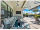 Covered lanai with comfortable seating and an outdoor ceiling fan at 17916 Northwood Pl, Lakewood Ranch, FL 34202