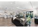 Bright and airy living room with hardwood floors, comfortable seating, and a view of the pool at 17916 Northwood Pl, Lakewood Ranch, FL 34202