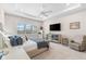 Serene main bedroom suite featuring tray ceilings, plush carpeting, plantation shutters, and neutral tones at 17916 Northwood Pl, Lakewood Ranch, FL 34202