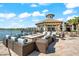 Stylish outdoor seating area with a fire pit, comfortable lounge chairs, and a lake view at 17916 Northwood Pl, Lakewood Ranch, FL 34202