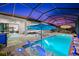 Inviting screened pool with a spa, water feature, lounge chairs, and an outdoor dining area create a relaxing oasis at 17916 Northwood Pl, Lakewood Ranch, FL 34202