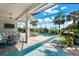 Outdoor pool and lanai with beautiful blue skies and lush landscaping at 17916 Northwood Pl, Lakewood Ranch, FL 34202