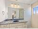 Bathroom with granite countertops, white cabinetry, and a walk-in shower at 1928 Harbourside Dr # 1403, Longboat Key, FL 34228