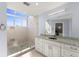 Clean bathroom featuring white cabinets and a glass shower at 1928 Harbourside Dr # 1403, Longboat Key, FL 34228