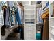 Walk-in closet with custom shelves, drawers, and plenty of storage space at 1928 Harbourside Dr # 1403, Longboat Key, FL 34228