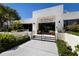 The Clubhouse at Fairway Bay with manicured landscaping and elegant entrance at 1928 Harbourside Dr # 1403, Longboat Key, FL 34228