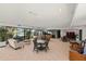 Expansive common area for gatherings features comfortable seating and stylish decor with poolside view at 1928 Harbourside Dr # 1403, Longboat Key, FL 34228