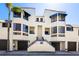 Inviting condo exterior with a private entrance, showcasing architectural charm and well-maintained landscaping at 1928 Harbourside Dr # 1403, Longboat Key, FL 34228