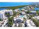 Aerial view showcases this waterfront condo community with a pool and stunning views of the bay at 1928 Harbourside Dr # 1403, Longboat Key, FL 34228