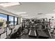 Bright gym with various cardio machines and large windows overlooking the beach at 1928 Harbourside Dr # 1403, Longboat Key, FL 34228