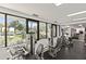 Well-equipped gym featuring weight machines and natural light from large windows at 1928 Harbourside Dr # 1403, Longboat Key, FL 34228