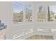 Sunlit kitchen nook featuring bright windows with shutter shades at 1928 Harbourside Dr # 1403, Longboat Key, FL 34228