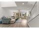 Spacious living room with stairs, lots of natural light and comfortable seating at 1928 Harbourside Dr # 1403, Longboat Key, FL 34228