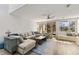 Spacious living room with stairs, lots of natural light and comfortable seating at 1928 Harbourside Dr # 1403, Longboat Key, FL 34228