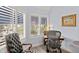 Bright sitting area with large windows, shutters and hardwood floors at 1928 Harbourside Dr # 1403, Longboat Key, FL 34228