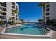 Inviting swimming pool featuring sparkling blue water and comfortable lounging options at 1928 Harbourside Dr # 1403, Longboat Key, FL 34228