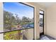 Balcony view of community pool and landscaping at 1928 Harbourside Dr # 1403, Longboat Key, FL 34228