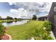 Well-maintained backyard with a view of the tranquil lake and lush landscaping at 19993 Benissimo Dr, Venice, FL 34293