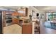 Modern kitchen with stainless steel appliances, granite countertops, and breakfast bar at 19993 Benissimo Dr, Venice, FL 34293