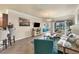Living room features an open floor plan, chandelier, and sliding glass doors at 19993 Benissimo Dr, Venice, FL 34293