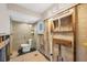 An unfinished bathroom featuring a glass shower with a tiled enclosure at 2100 Benjamin Franklin Dr # 104, Sarasota, FL 34236