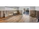 A living room that is unfinished with wood look flooring at 2100 Benjamin Franklin Dr # 104, Sarasota, FL 34236