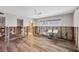 A living room that is unfinished, with new floors at 2100 Benjamin Franklin Dr # 104, Sarasota, FL 34236
