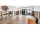 Spacious living room with new tile floors and sliding glass doors to the outside area at 2100 Benjamin Franklin Dr # 104, Sarasota, FL 34236