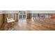 A living room with the walls unfinished and wood look flooring at 2100 Benjamin Franklin Dr # 104, Sarasota, FL 34236
