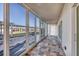 Lovely patio featuring sliding glass doors, offering serene outdoor views at 2100 Benjamin Franklin Dr # 104, Sarasota, FL 34236