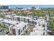 Aerial view of modern townhome community and surrounding cityscape at 232 Cosmopolitan Ct, Sarasota, FL 34236