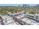 Charming townhomes offer architectural beauty with garage parking, enveloped by a lush landscape of trees at 232 Cosmopolitan Ct, Sarasota, FL 34236