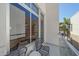 Cozy balcony featuring comfortable seating and glass railings with views of the neighborhood at 232 Cosmopolitan Ct, Sarasota, FL 34236