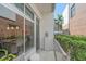 Charming balcony featuring outdoor seating and views of the surrounding landscape and neighborhood at 232 Cosmopolitan Ct, Sarasota, FL 34236