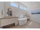 Elegant bathroom with soaking tub, double vanities, and modern fixtures at 232 Cosmopolitan Ct, Sarasota, FL 34236