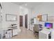 Well-lit home office features a bulletin board, two work spaces, and extra storage at 232 Cosmopolitan Ct, Sarasota, FL 34236