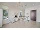 Office area with computer desk, tile flooring, and natural lighting at 232 Cosmopolitan Ct, Sarasota, FL 34236