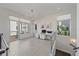 Bright home office area featuring tile flooring, balcony, and plenty of natural light at 232 Cosmopolitan Ct, Sarasota, FL 34236
