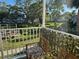 Relaxing balcony with quaint chairs overlooking a serene green space in a tranquil community, perfect for unwinding at 2330 Canal Dr # G27, Bradenton, FL 34207