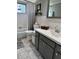 A cozy bathroom featuring a tiled floor, bathtub, white shower curtain, and sink at 2330 Canal Dr # G27, Bradenton, FL 34207