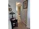 A charming bedroom with a stained glass lamp and a glimpse into the ensuite bathroom at 2330 Canal Dr # G27, Bradenton, FL 34207