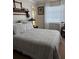 Inviting bedroom with a large bed, soft lighting from the window, and tasteful decor at 2330 Canal Dr # G27, Bradenton, FL 34207