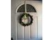 Charming front door adorned with a festive St. Patrick's Day wreath at 2330 Canal Dr # G27, Bradenton, FL 34207