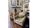 Cozy living room featuring a comfortable armchair, complemented by charming decor and a serene atmosphere at 2330 Canal Dr # G27, Bradenton, FL 34207
