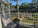 Balcony view showcasing beautiful landscaping and seating, perfect for relaxing and enjoying the serene atmosphere at 2330 Canal Dr # G27, Bradenton, FL 34207