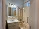 Classic bathroom featuring tub, vanity, and tiled walls at 2530 9Th W Ave, Bradenton, FL 34205