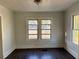 The bedroom features hardwood floors and two bright windows at 2530 9Th W Ave, Bradenton, FL 34205